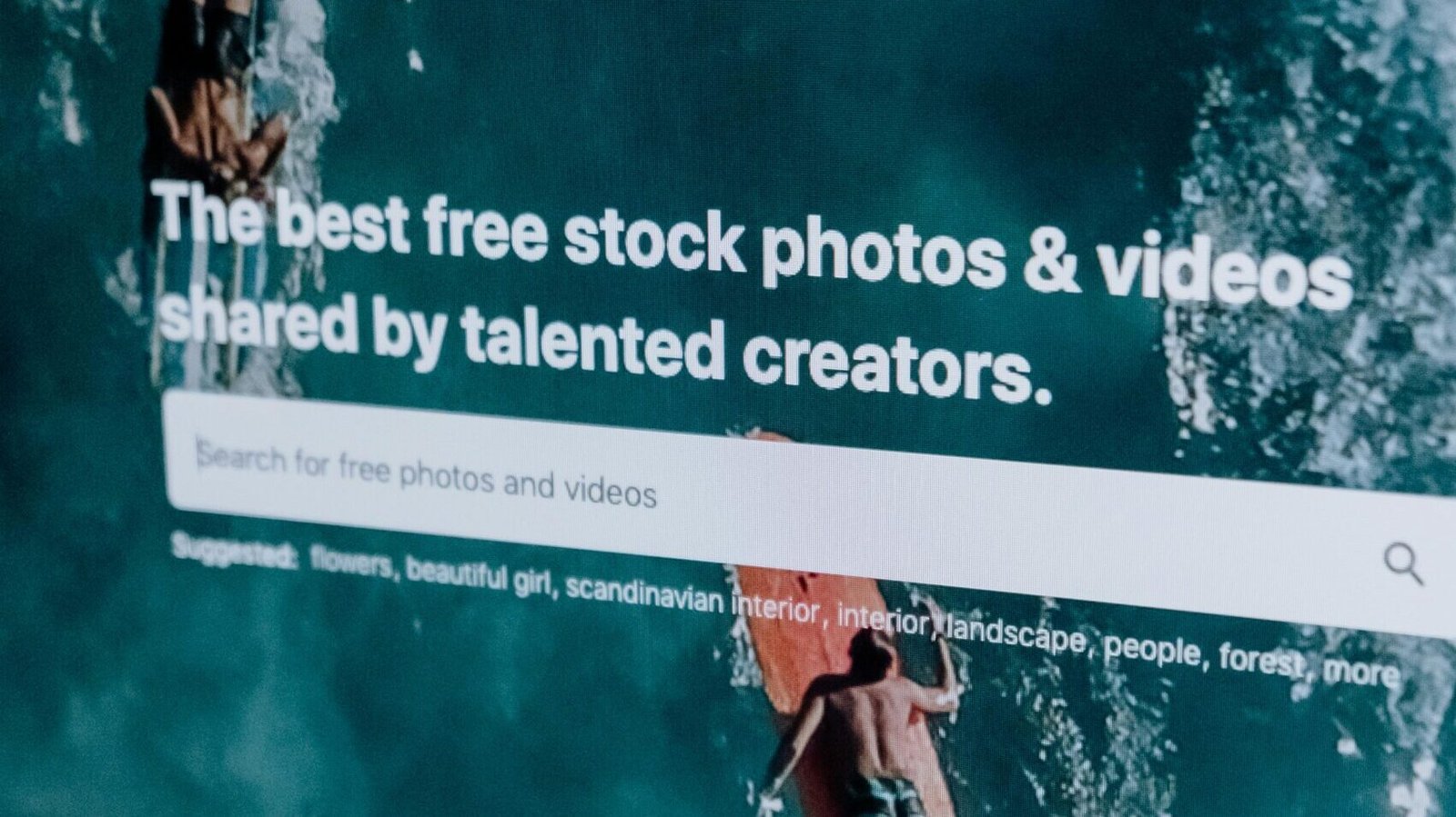 Close-up of a computer screen showing a stock photo website interface with multiple images.